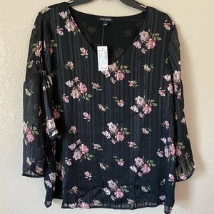Black blouse with pink flowers.